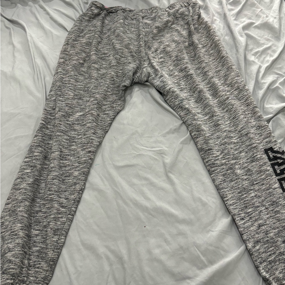 Nice pink sweatpants gray with a little bit of black color on it